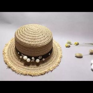 Brand new Straw hat with pearls and flowers